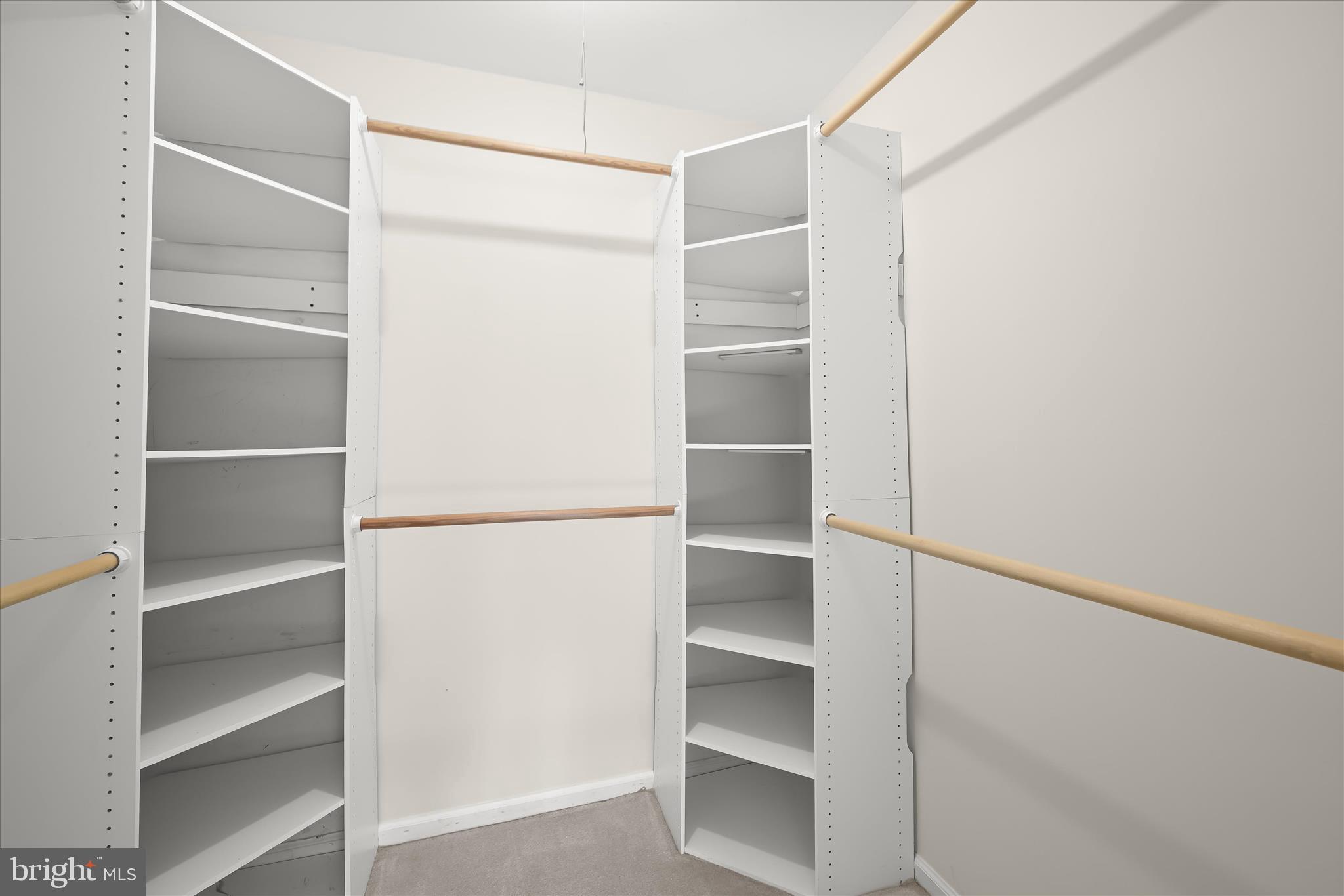 10428 Schoolmaster Place Columbia, MD 21044 - Photo 37 of 69 a view of walk in closet with empty racks