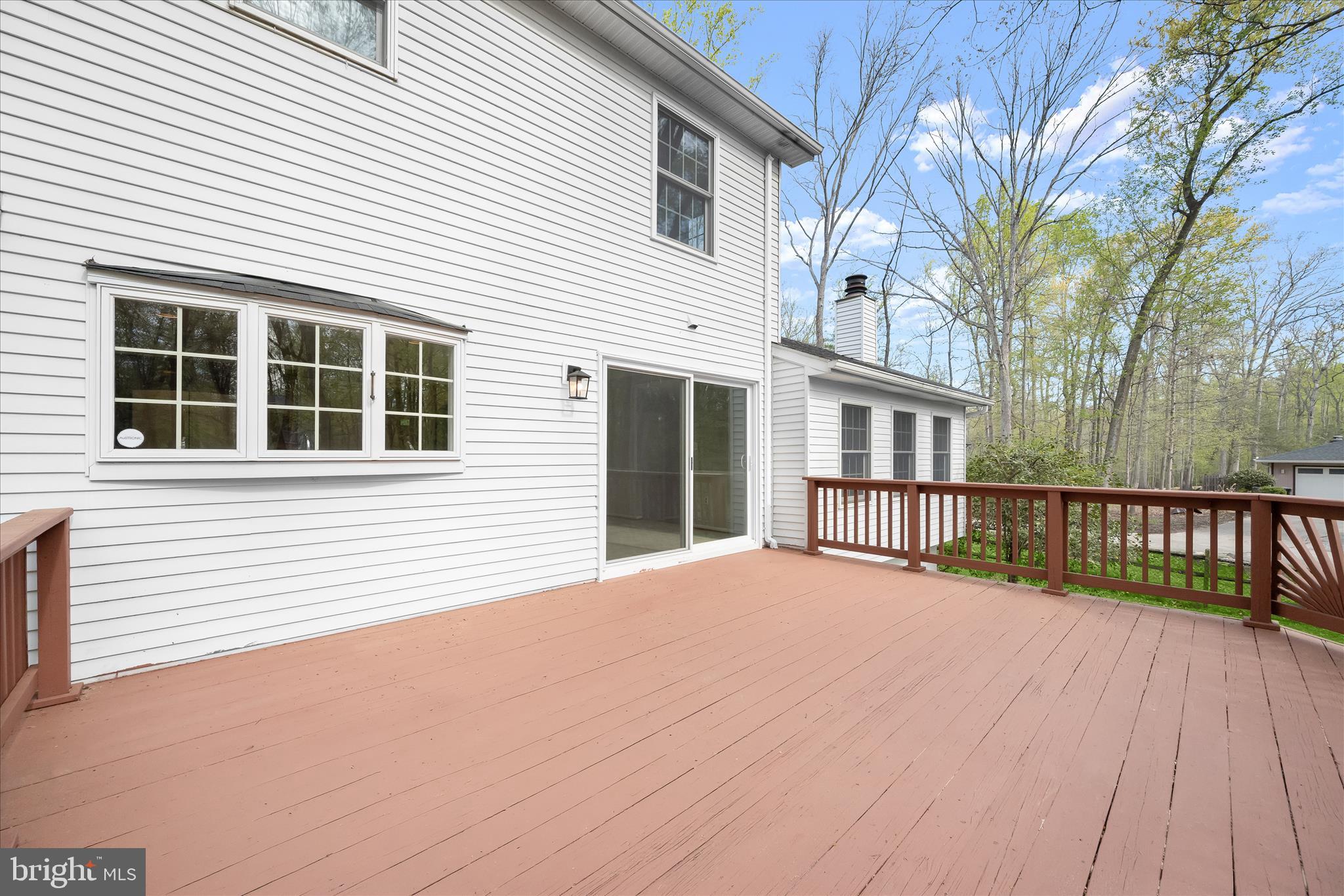 10428 Schoolmaster Place Columbia, MD 21044 - Photo 51 of 69 a view of a house with a wooden deck