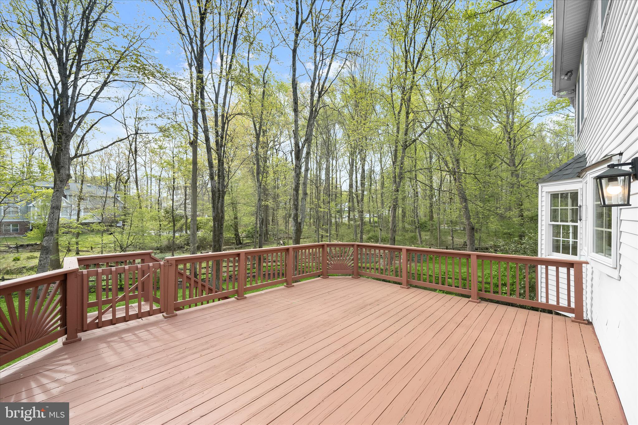 10428 Schoolmaster Place Columbia, MD 21044 - Photo 53 of 69 a view of balcony with wooden floor and fence