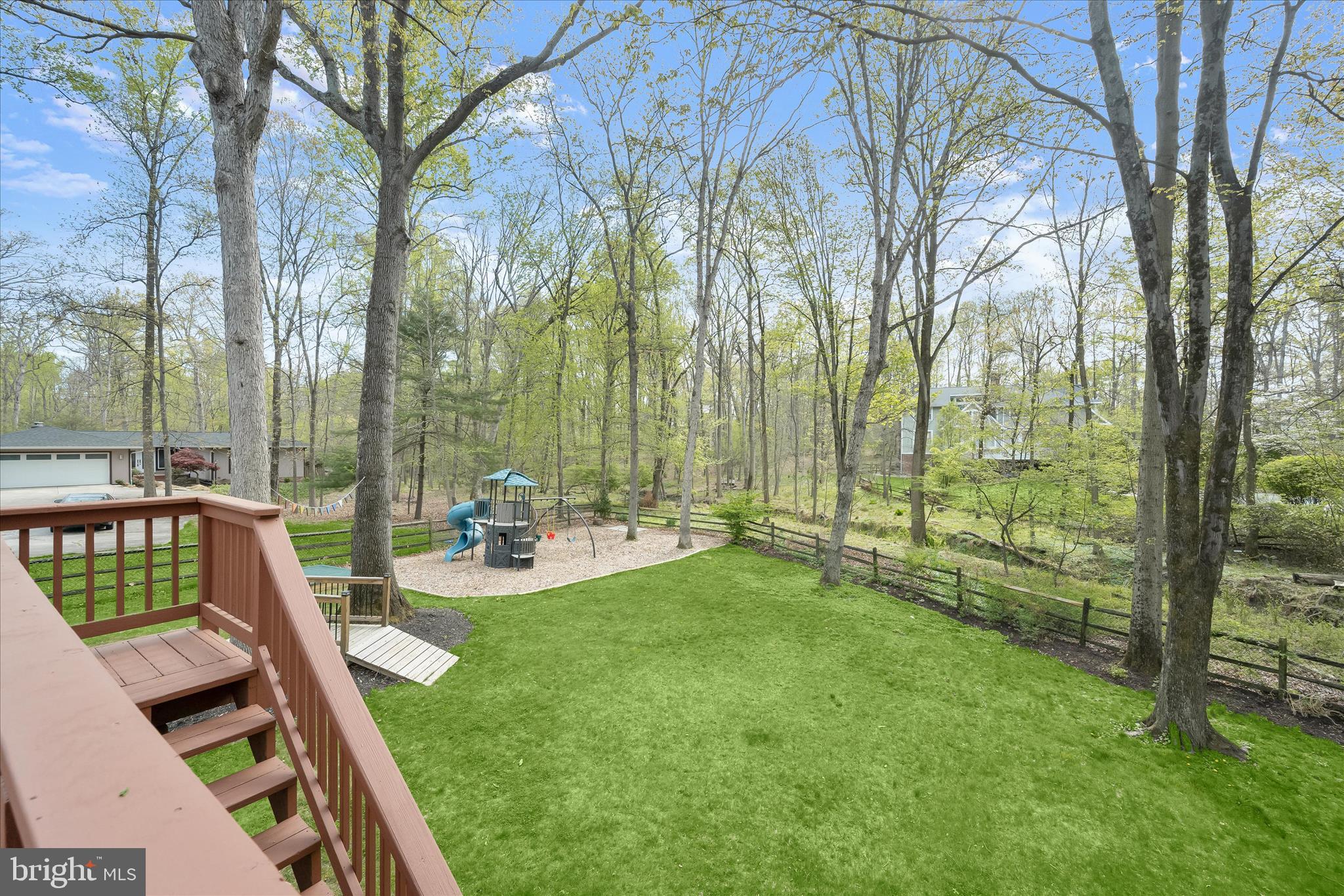 10428 Schoolmaster Place Columbia, MD 21044 - Photo 57 of 69 a view of backyard with a large trees and wooden fence