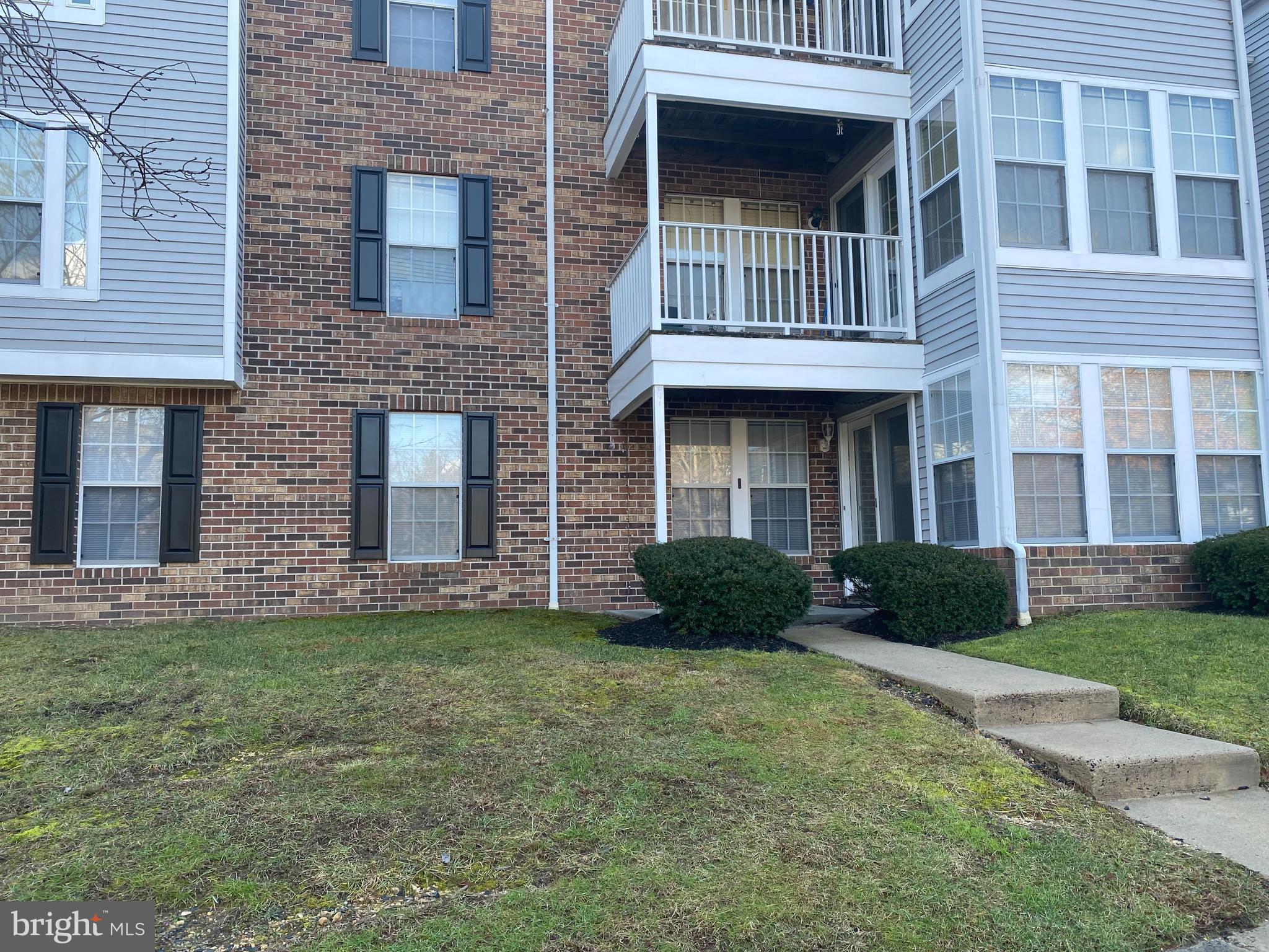 1401-a Golden Rod Court, Unit 1 Belcamp, MD 21017 - Photo 1 of 17 a view of a brick house with a yard