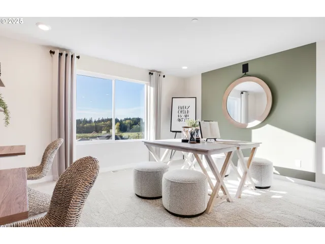 a living room with furniture a flat screen tv and a floor