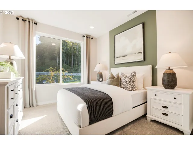 a view of a dining room with furniture and a large window