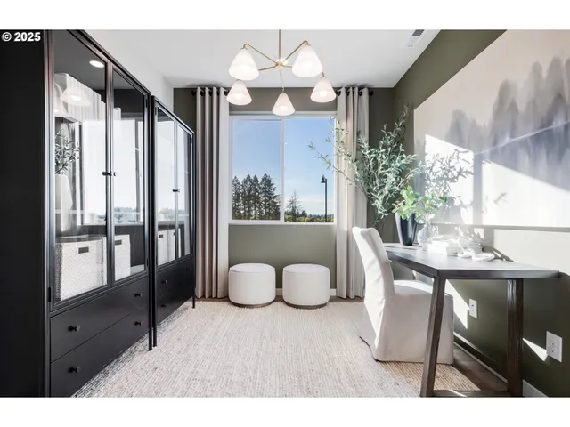 a living room with furniture a fireplace and a chandelier
