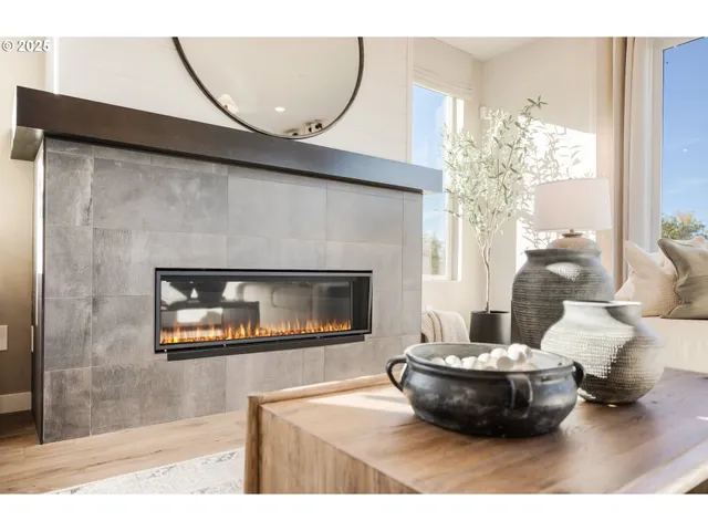 a kitchen with kitchen island granite countertop wooden floor cabinets dining table and chairs