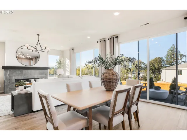 a kitchen with cabinets and chairs