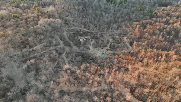 a view of small space with wooden fence