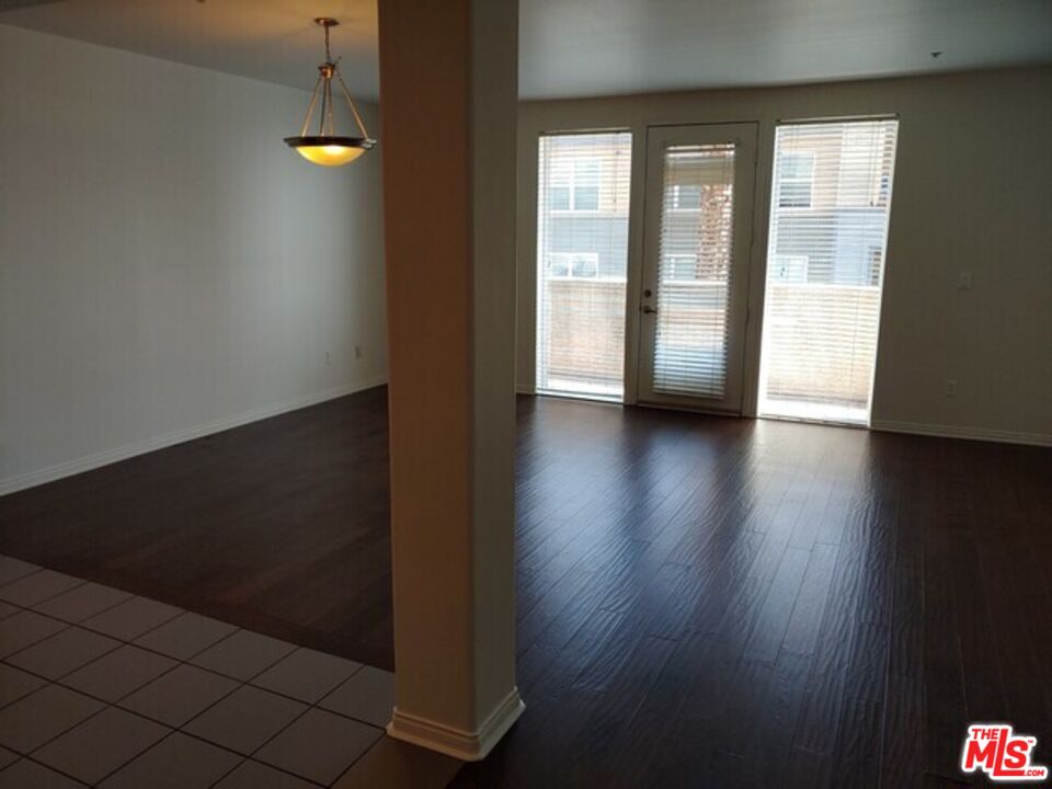 360 West Ave 26, Unit 339 Los Angeles, CA 90031 - Photo 2 of 10 a view of an empty room with wooden floor and a window