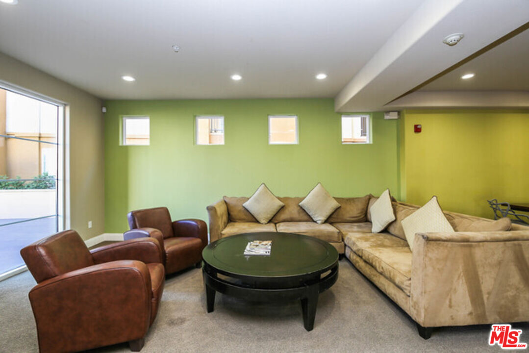 360 West Ave 26, Unit 339 Los Angeles, CA 90031 - Photo 9 of 10 a living room with furniture and a large window