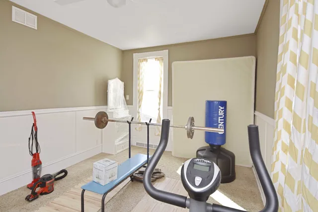 a bathroom with a sink mirror and toilet