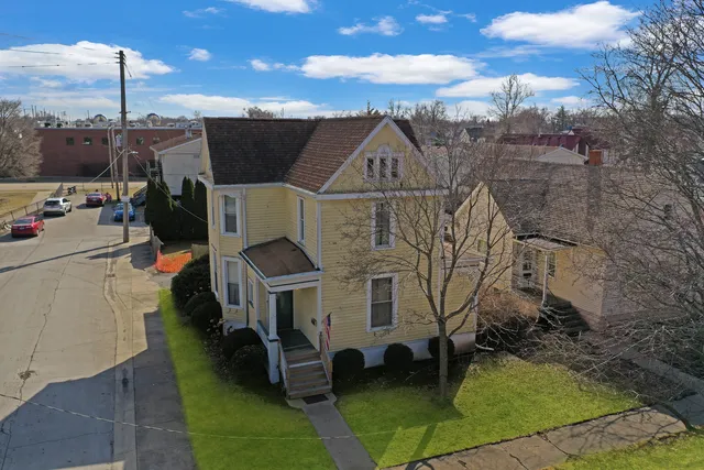a aerial view of a house with a yard