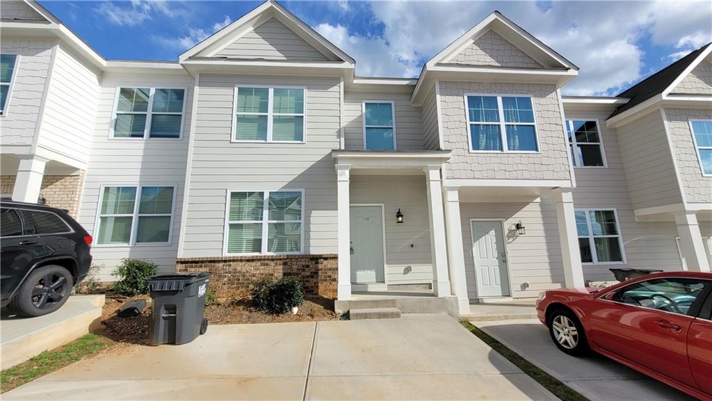 2780 Laurel Ridge Circle East Point, GA 30344 - Photo 1 of 1 a front view of a house with outdoor seating
