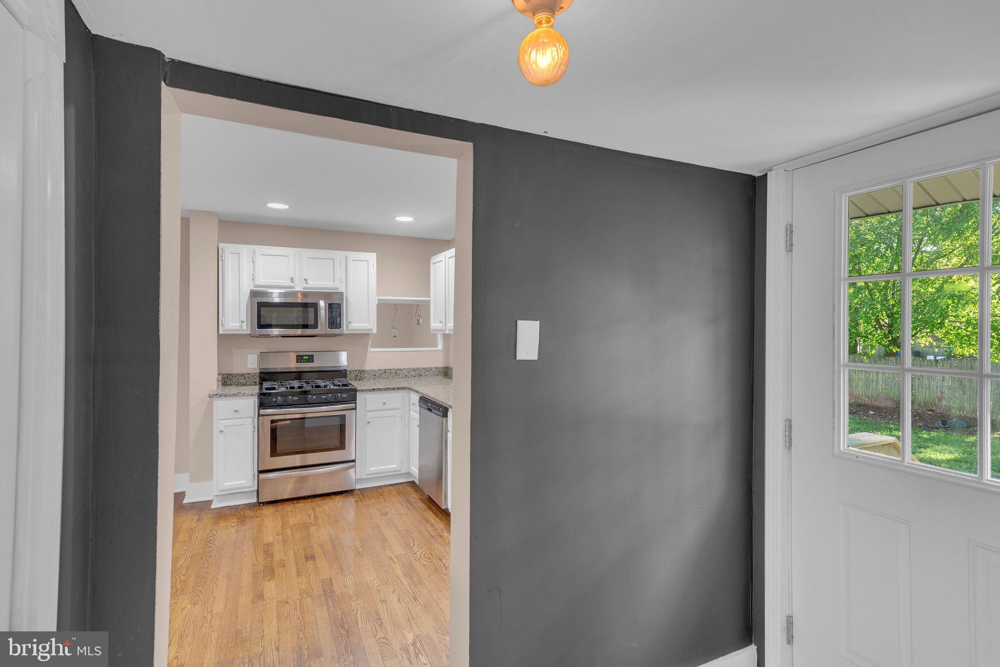 820 Laurel Street Delanco, NJ 08075 - Photo 13 of 23 a kitchen with stainless steel appliances a refrigerator and a stove top oven