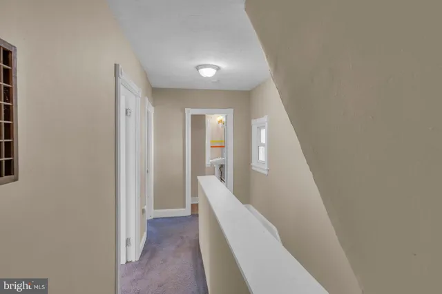 a view of a hallway with staircase