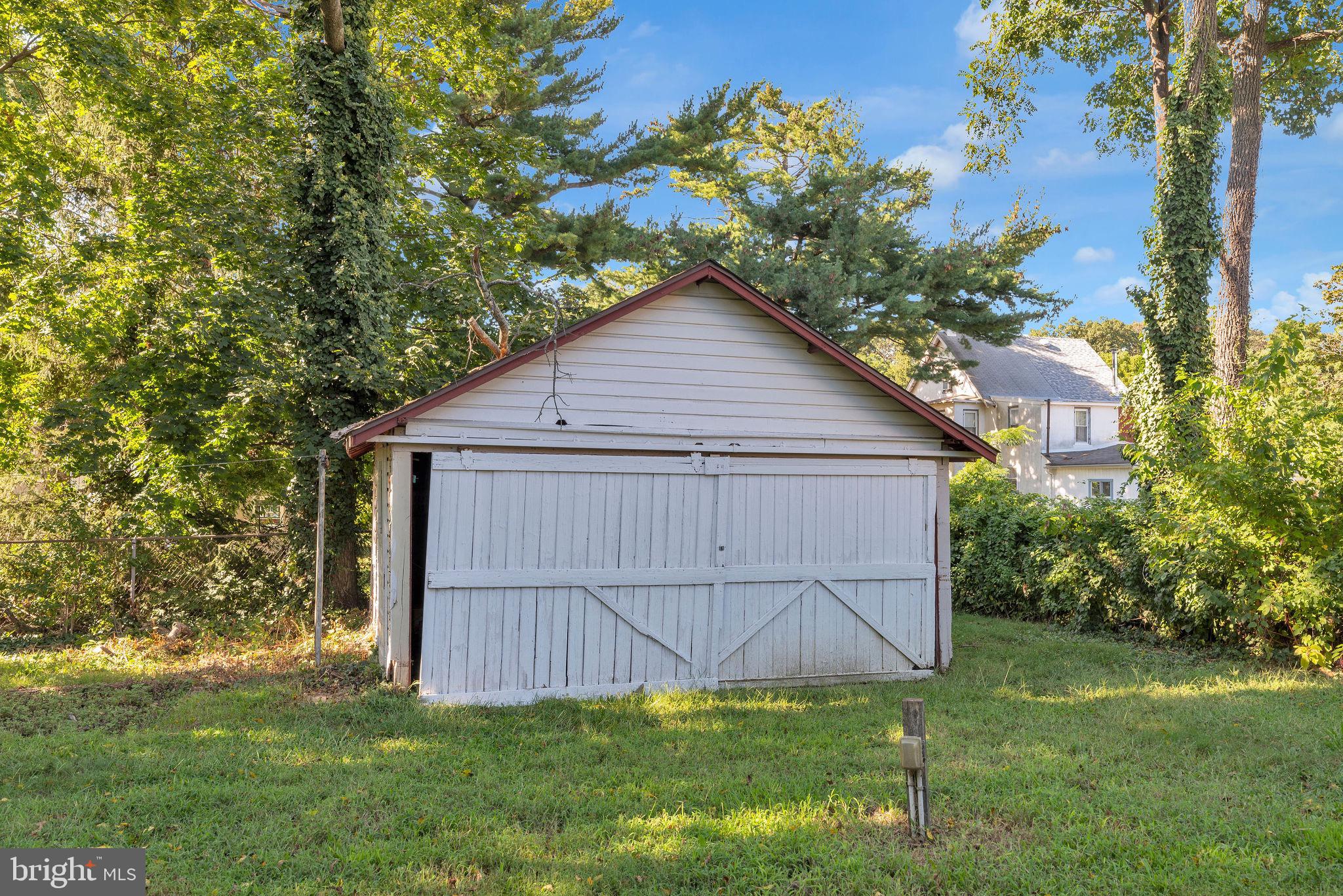 820 Laurel Street Delanco, NJ 08075 - Photo 23 of 23 a view of backyard with potted plants and large tree