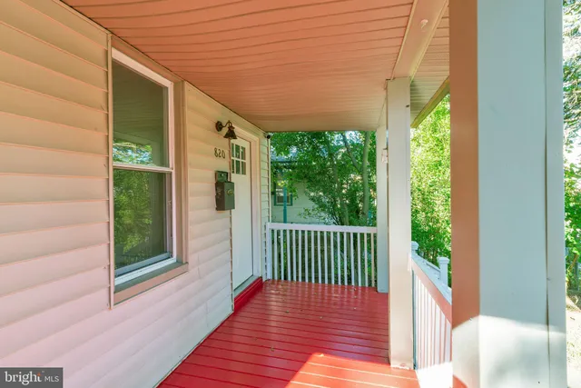 a view of a porch with wooden floor and outdoor space
