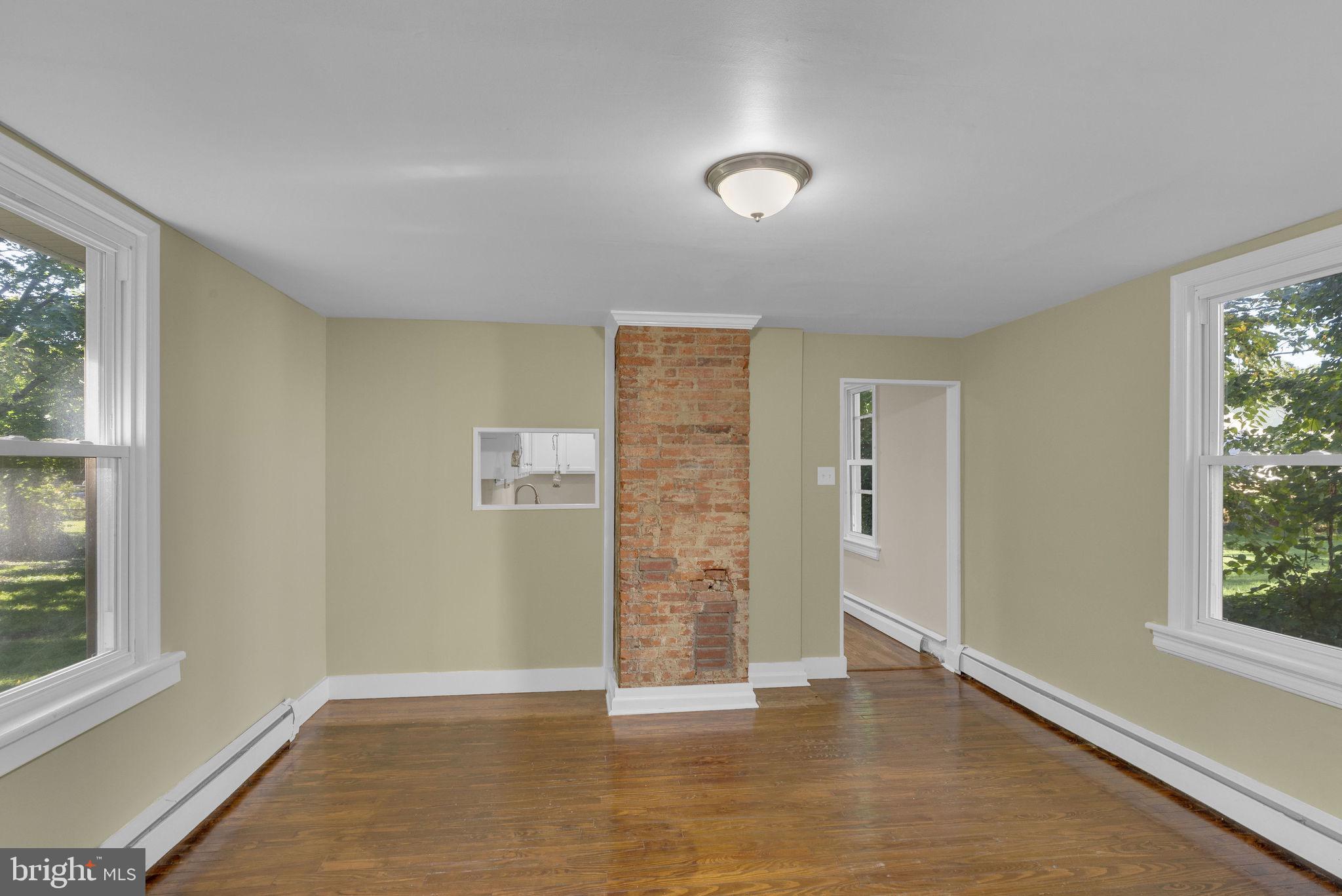 820 Laurel Street Delanco, NJ 08075 - Photo 7 of 23 an empty room with wooden floor and windows