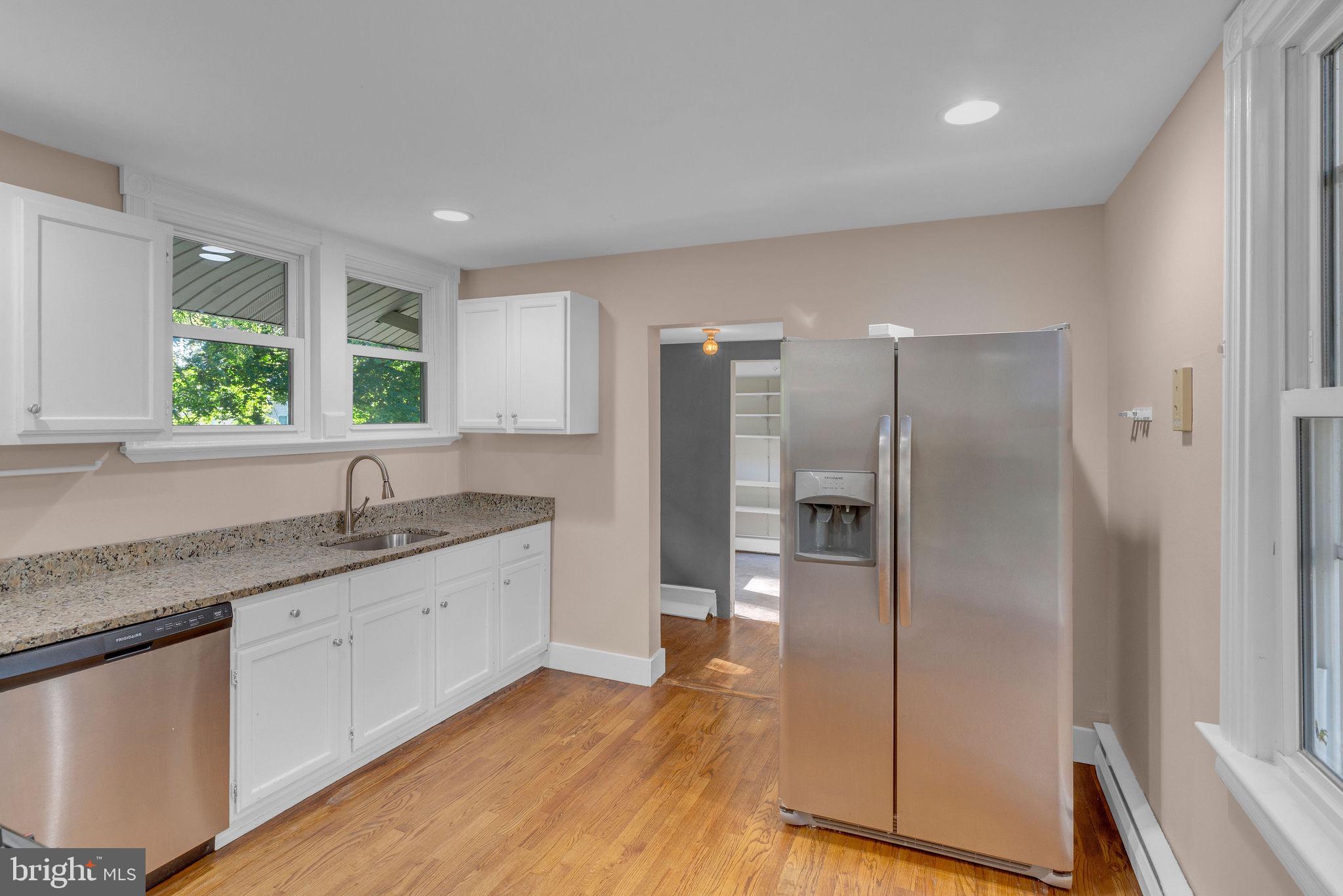 820 Laurel Street Delanco, NJ 08075 - Photo 9 of 23 a kitchen with granite countertop a refrigerator and a sink