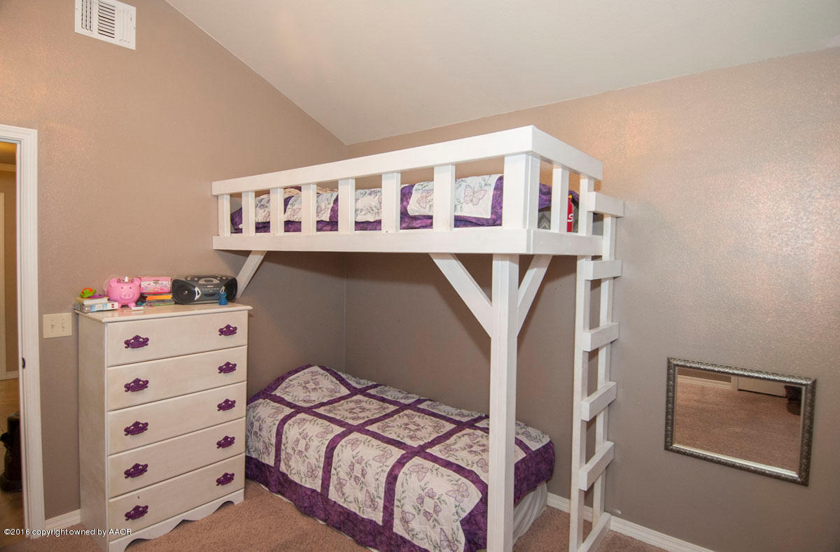 3915 Arden Road Amarillo, TX 79118 - Photo 25 of 37 a bedroom with a bed and a dresser