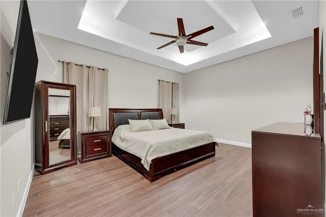 a bathroom with a glass shower door and a bathtub