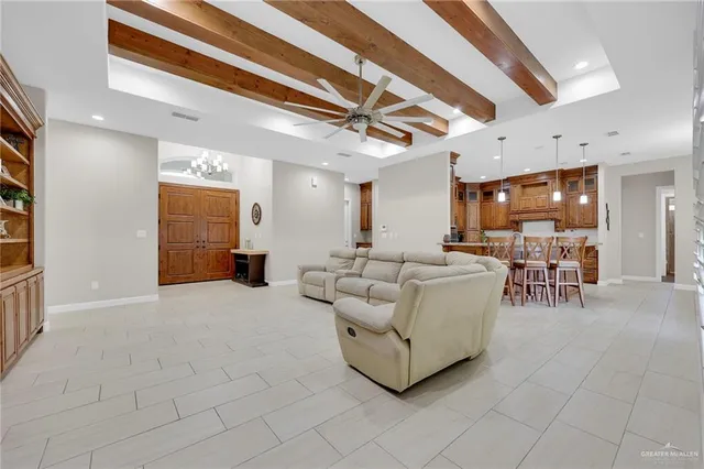 a kitchen with stainless steel appliances kitchen island granite countertop a table and chairs