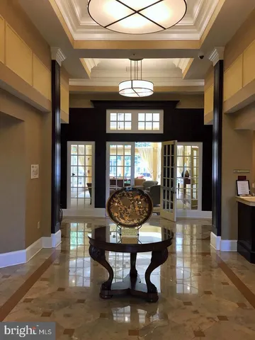 a living room with fireplace furniture and a large window