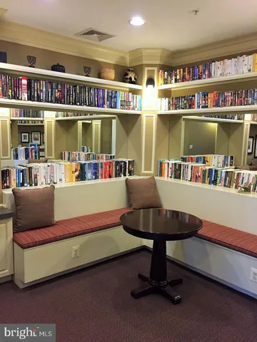 a view of a dining room with furniture and windows