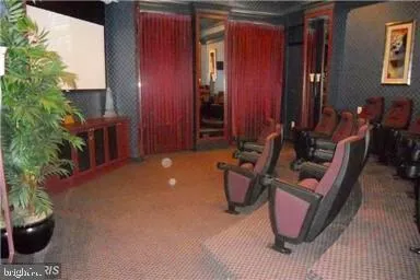 a street sign that is sitting in front of flowers