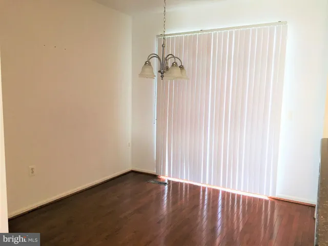 a view of a small space with wooden floor
