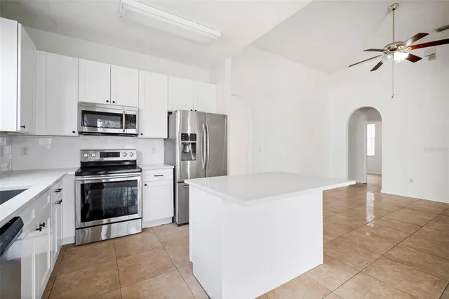 a kitchen with a stove microwave and refrigerator