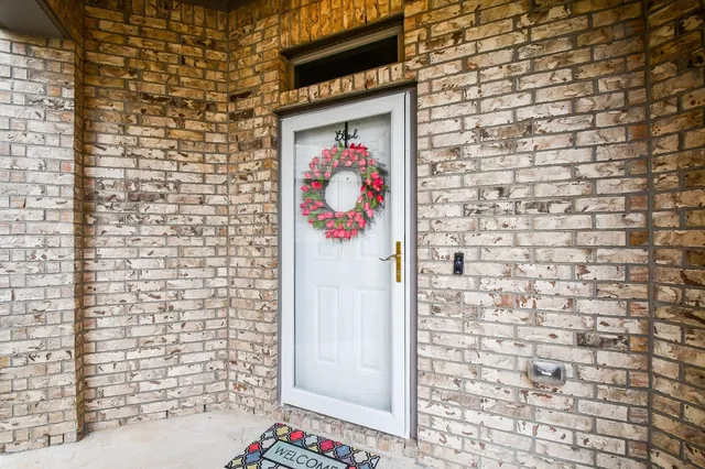 a door with brick wall