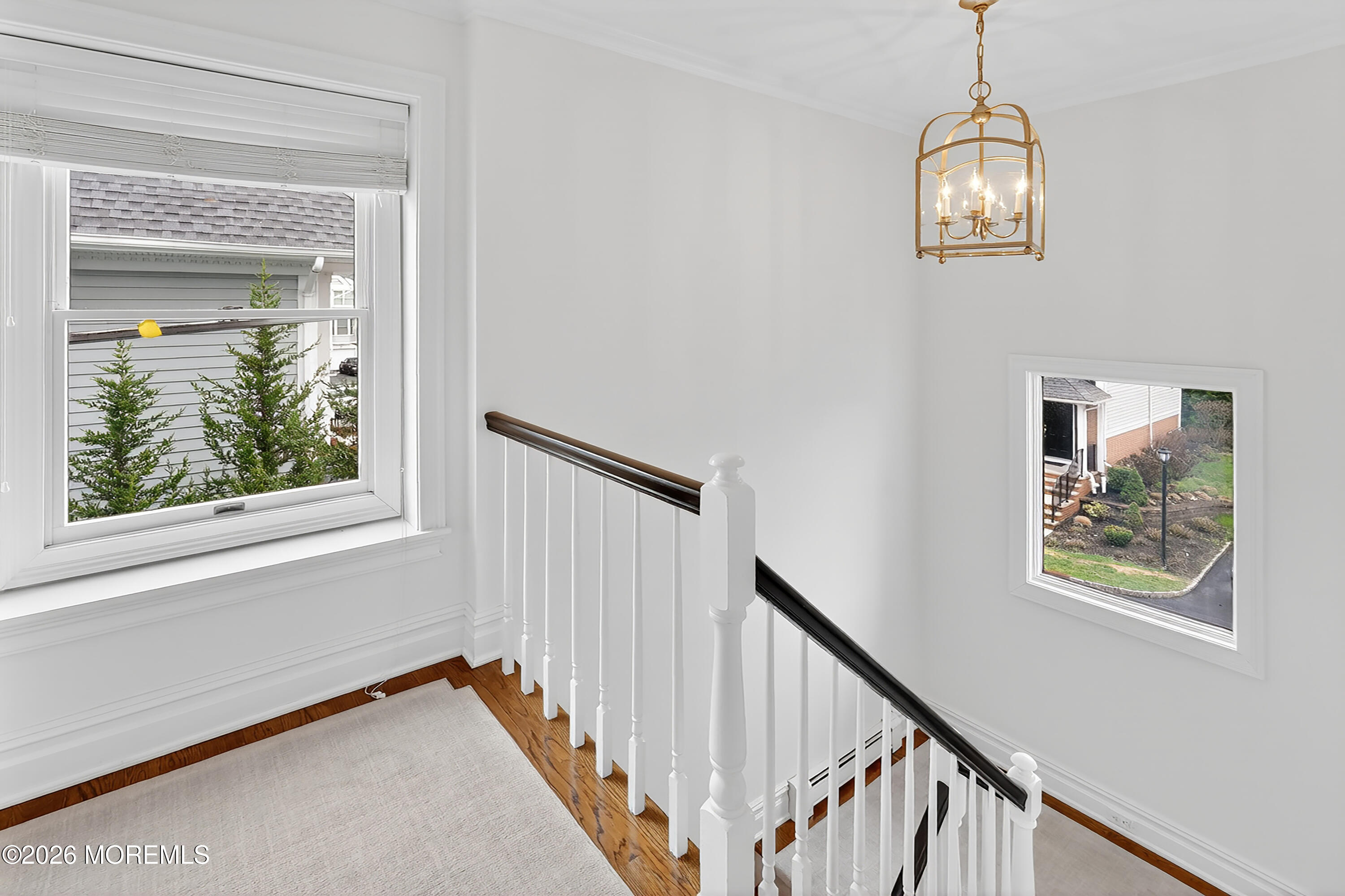 65 East River Road, Unit 20 Rumson, NJ 07760 - Photo 13 of 37 a view of a hallway with windows and chandelier