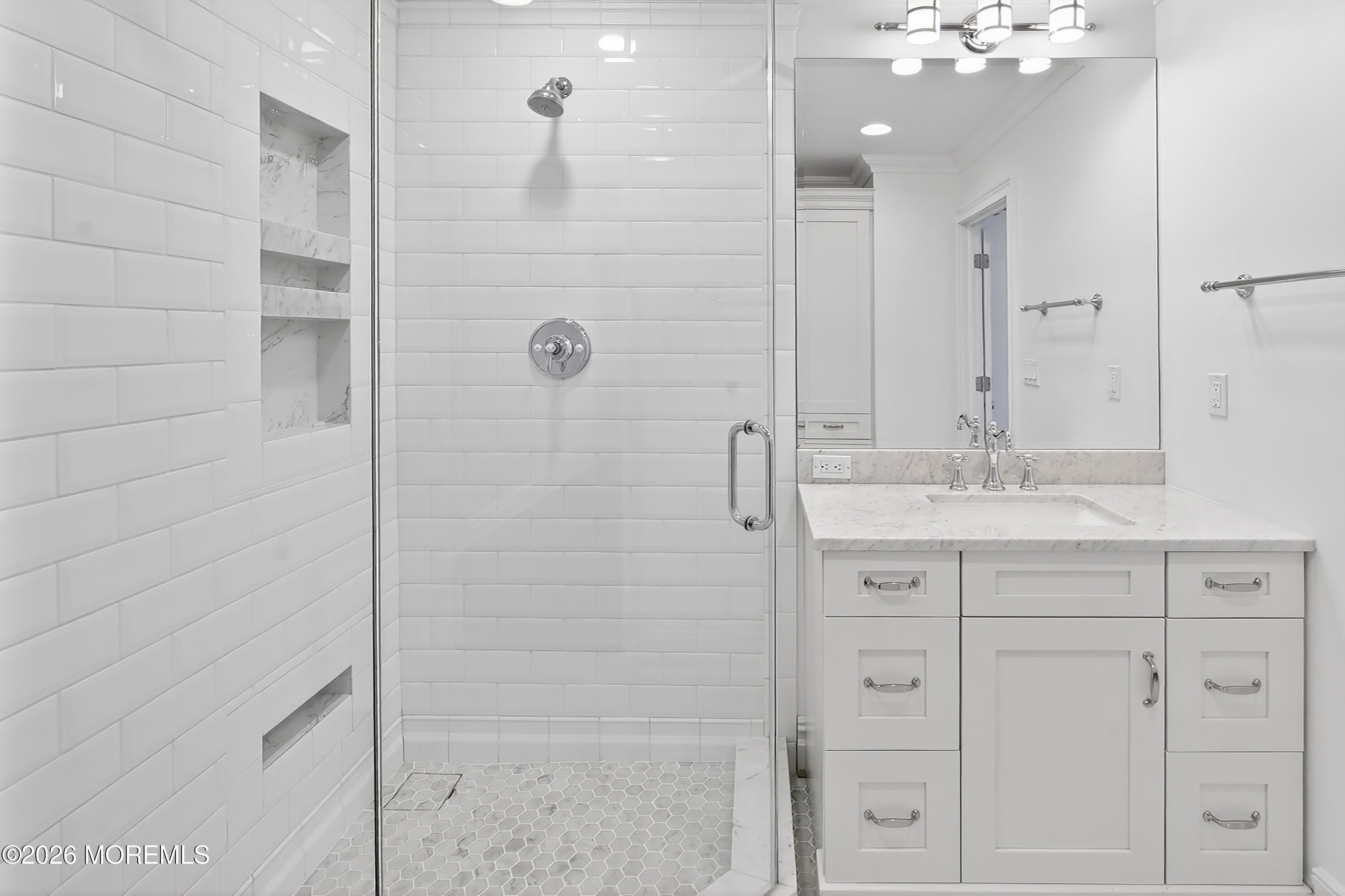 65 East River Road, Unit 20 Rumson, NJ 07760 - Photo 17 of 37 a bathroom with a shower sink and mirror