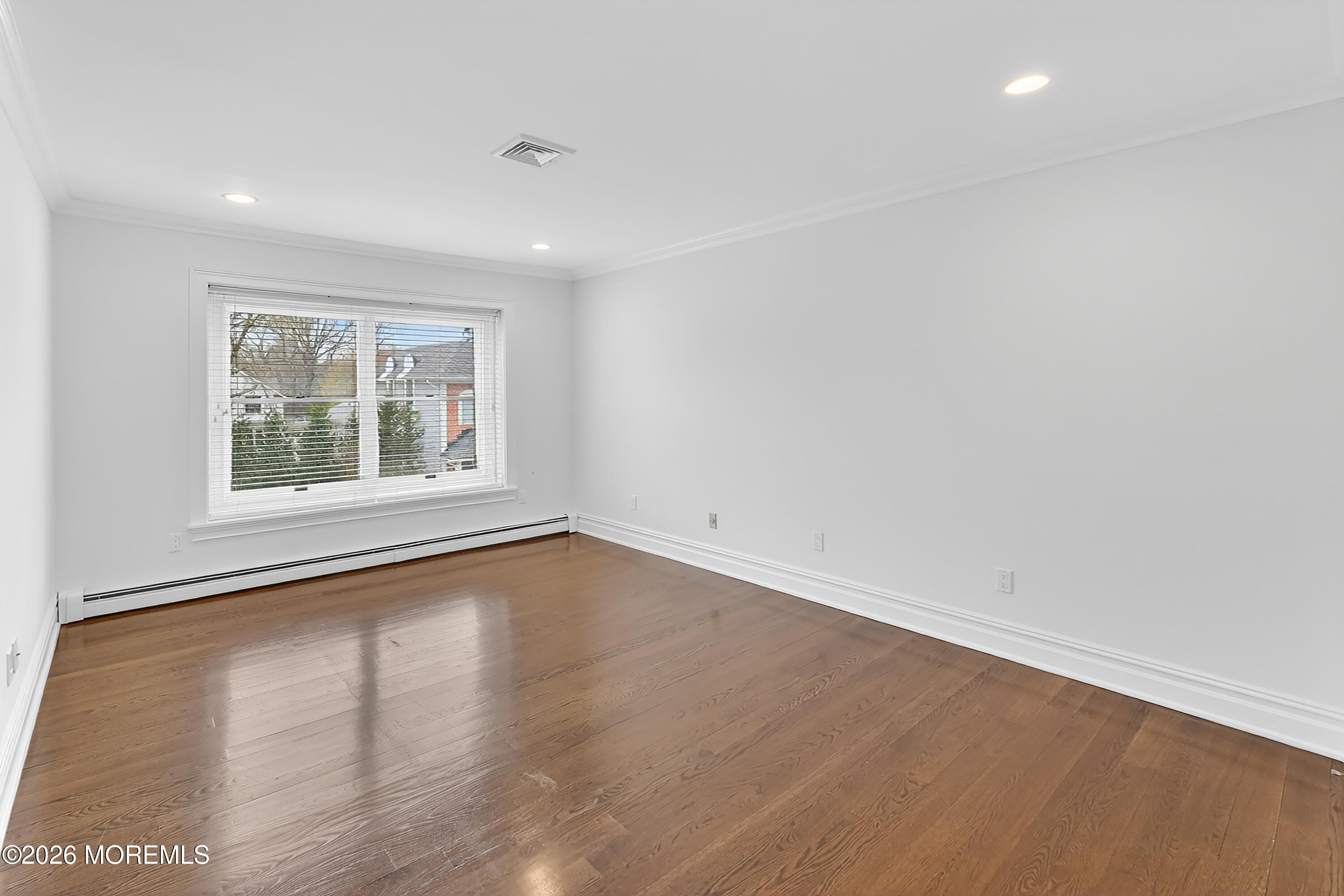 65 East River Road, Unit 20 Rumson, NJ 07760 - Photo 18 of 37 an empty room with wooden floor and windows