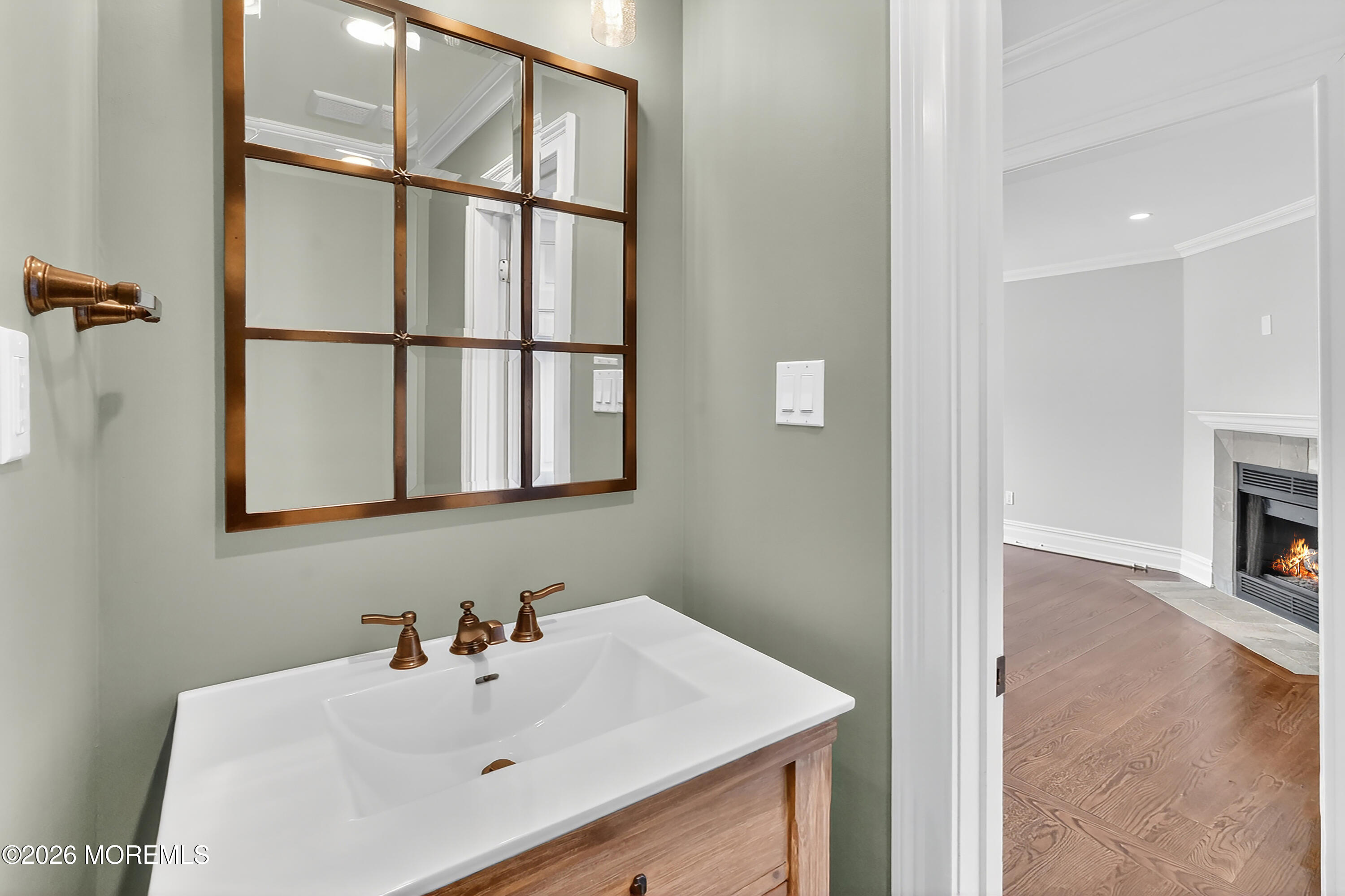 65 East River Road, Unit 20 Rumson, NJ 07760 - Photo 19 of 37 a bathroom with a sink and a mirror