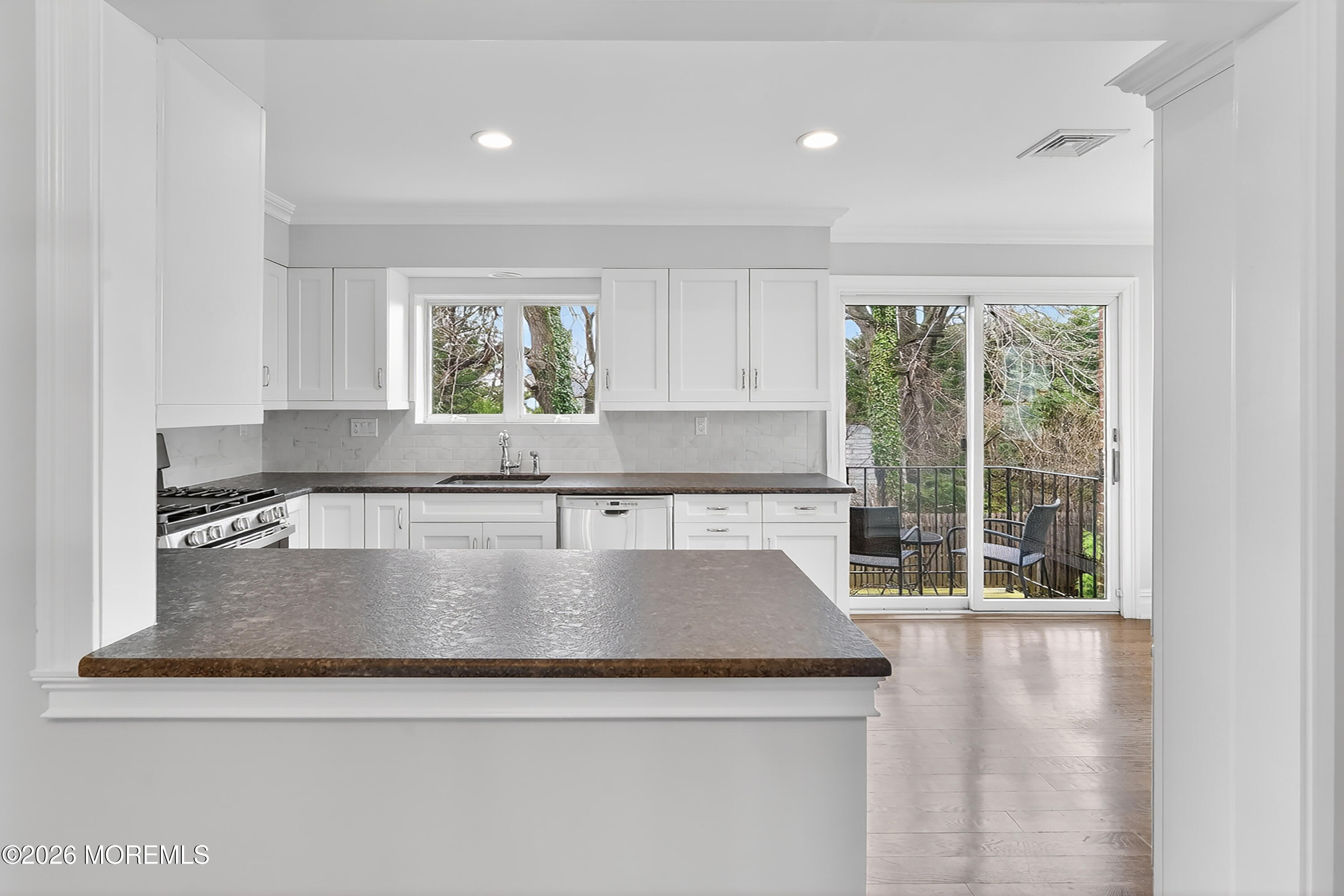 65 East River Road, Unit 20 Rumson, NJ 07760 - Photo 23 of 37 a view of a kitchen counter space a window and appliances
