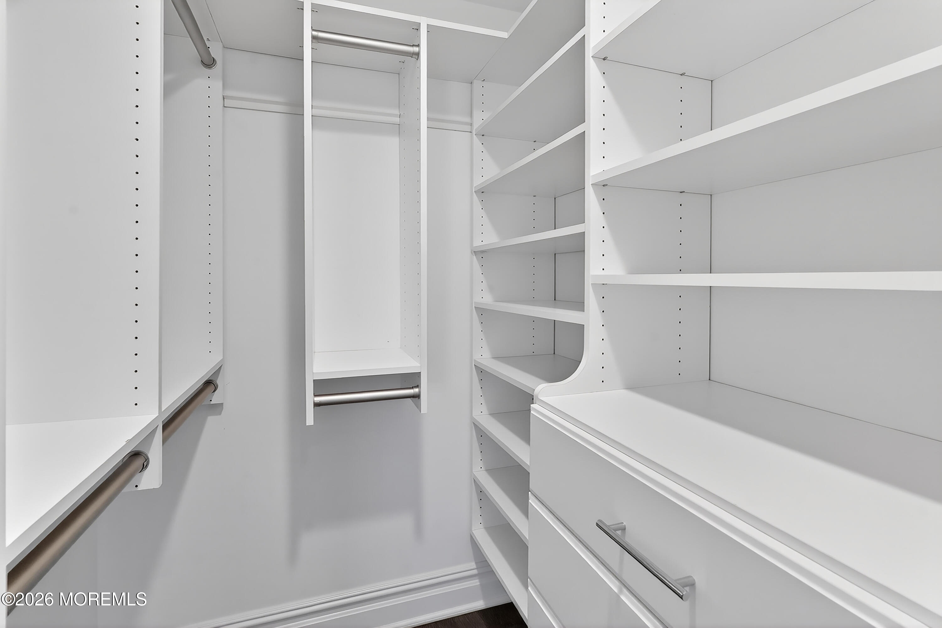 65 East River Road, Unit 20 Rumson, NJ 07760 - Photo 28 of 37 a view of an empty walk in closet