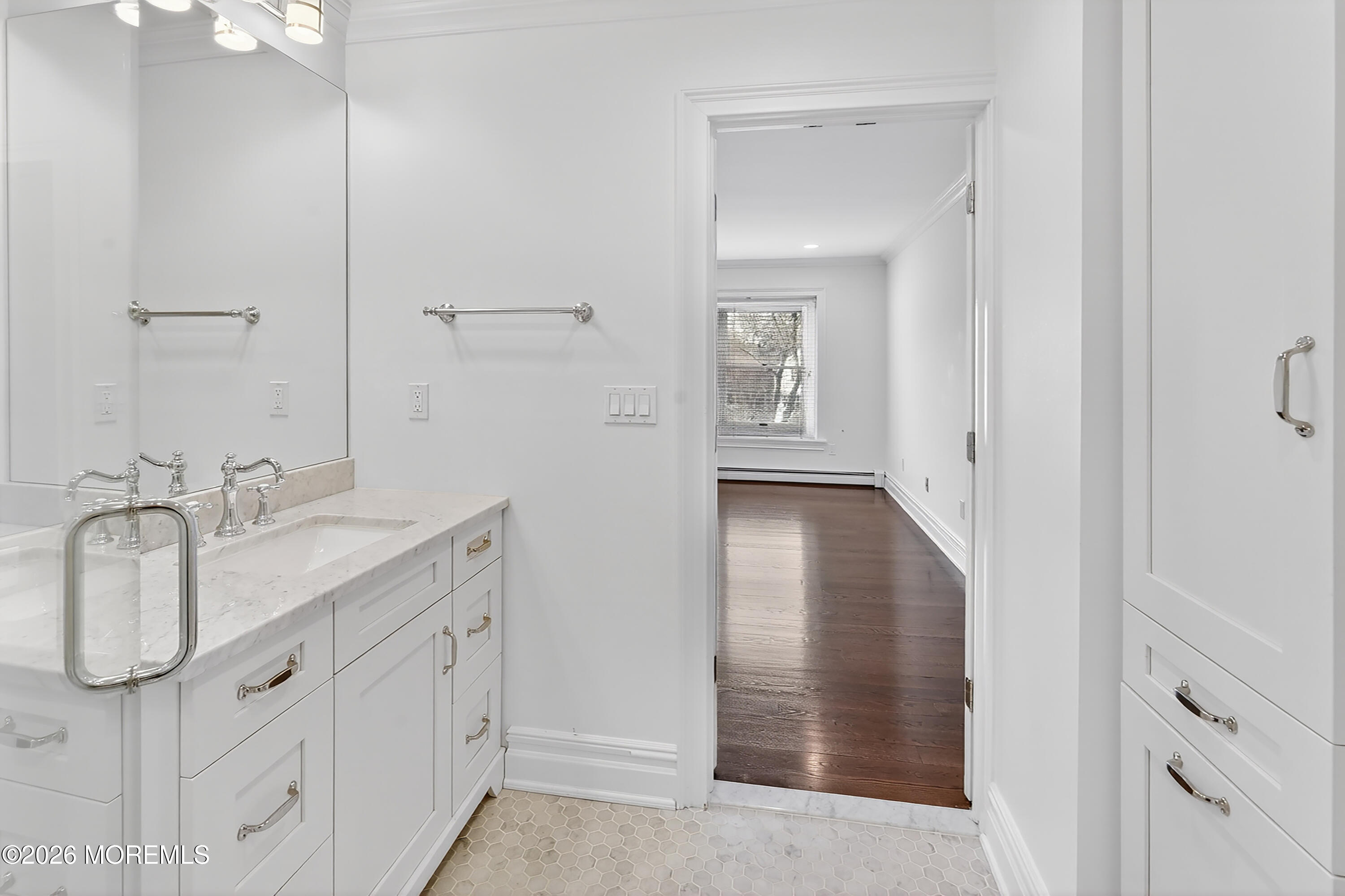 65 East River Road, Unit 20 Rumson, NJ 07760 - Photo 30 of 37 a bathroom with a granite countertop sink mirror and vanity