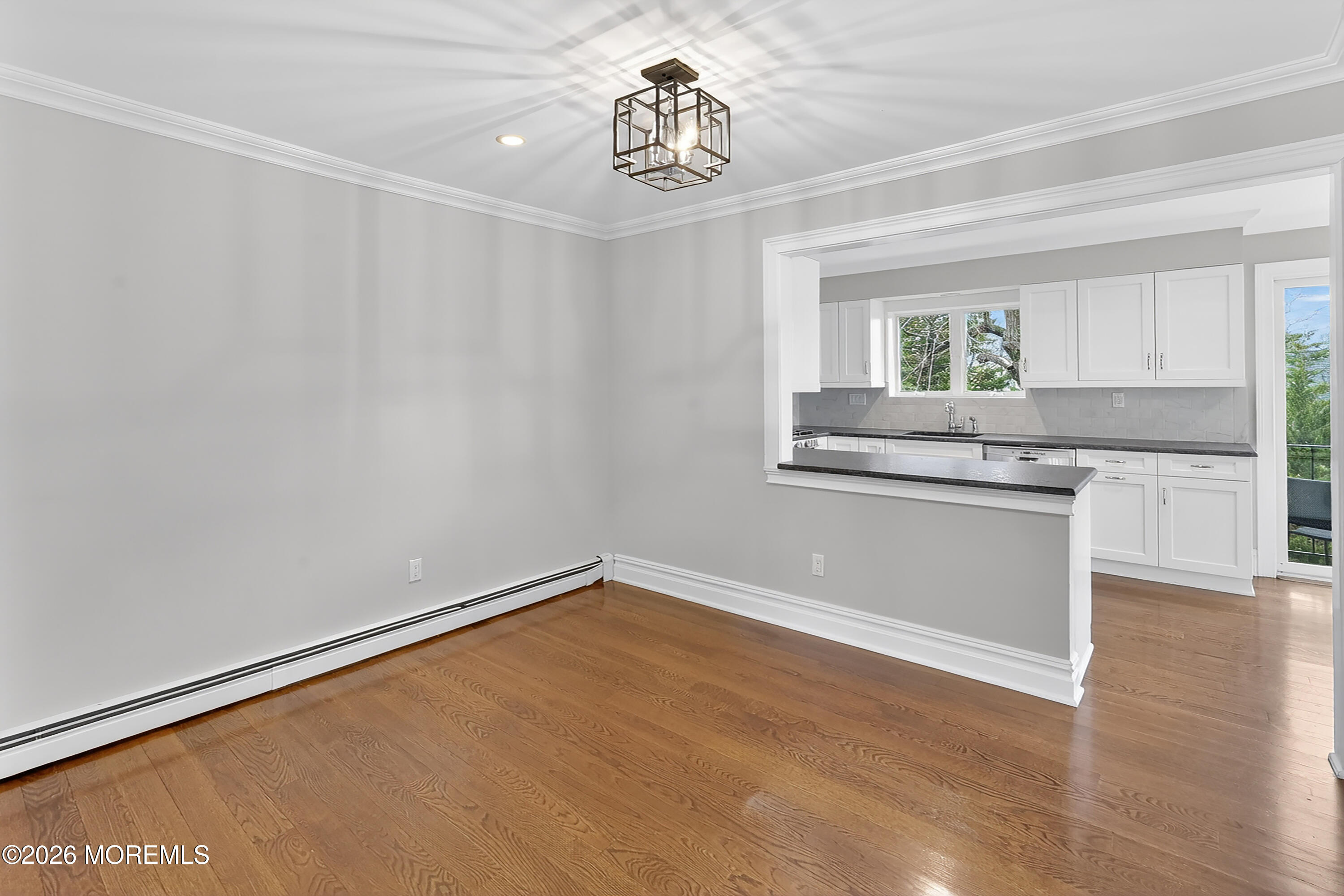 65 East River Road, Unit 20 Rumson, NJ 07760 - Photo 10 of 37 a view of a kitchen with wooden floor and electronic appliances