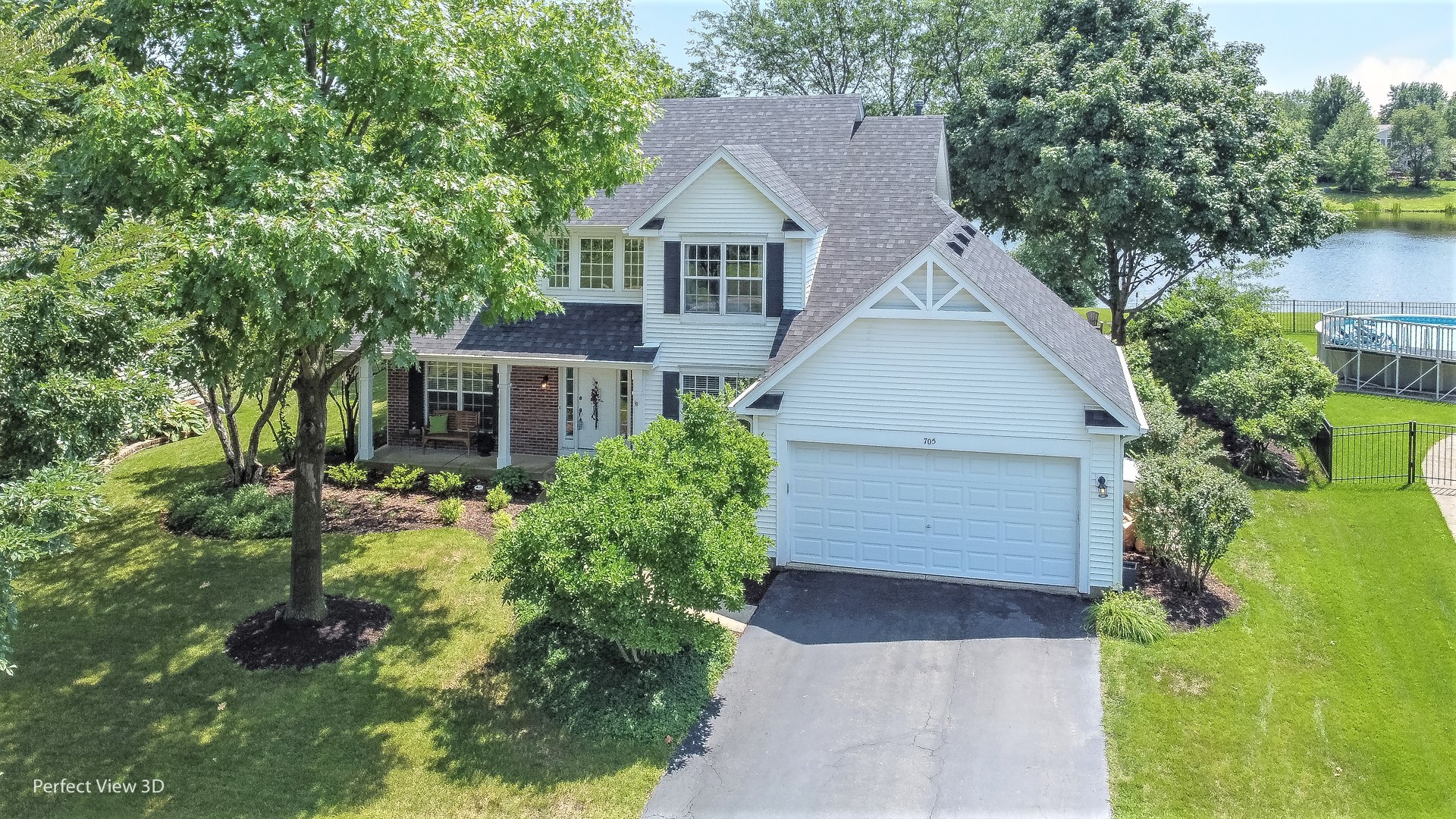 705 Churchill Lane Oswego, IL 60543 - Photo 1 of 34 front view of house with a yard and trees all around
