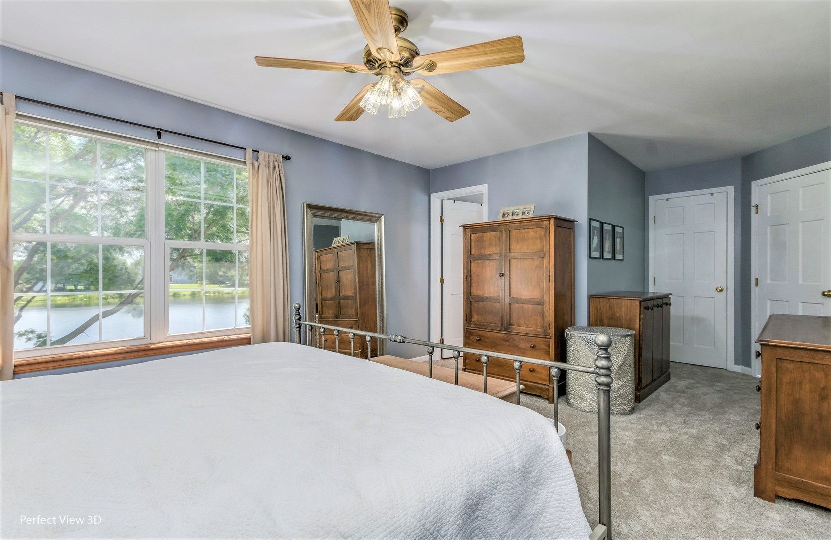 705 Churchill Lane Oswego, IL 60543 - Photo 18 of 34 a bedroom with a balcony a bed and a chandelier