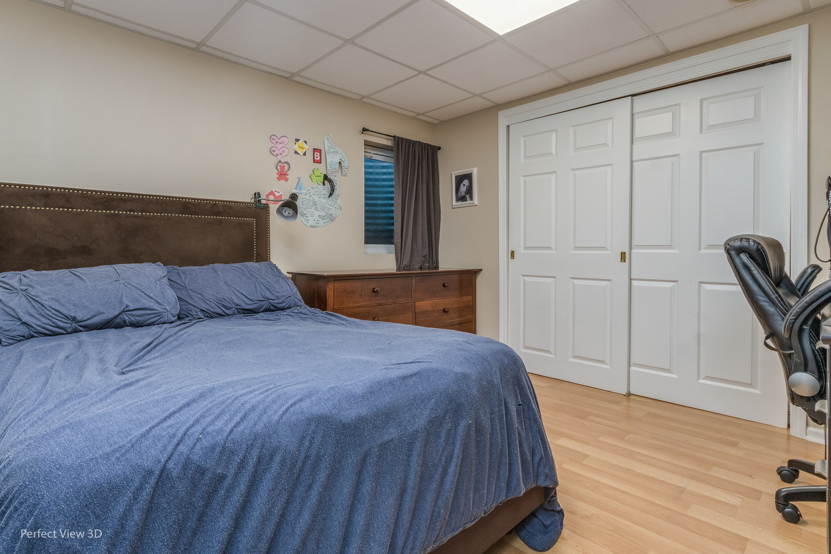705 Churchill Lane Oswego, IL 60543 - Photo 23 of 34 a bedroom with a bed and a dresser next to a window