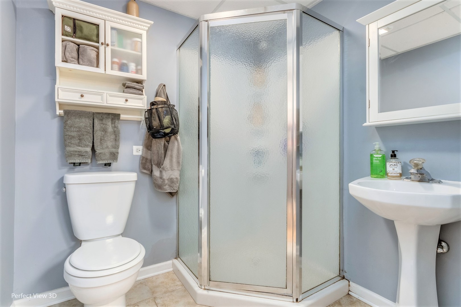 705 Churchill Lane Oswego, IL 60543 - Photo 26 of 34 a bathroom with a toilet sink and shower