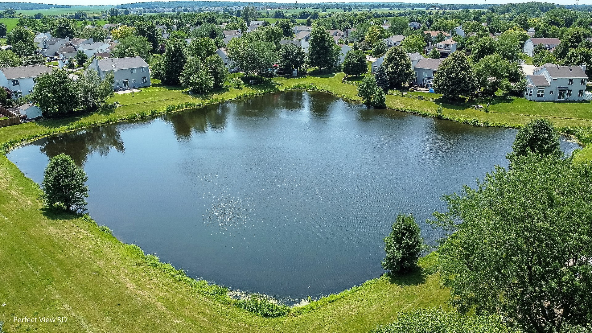 705 Churchill Lane Oswego, IL 60543 - Photo 31 of 34 an aerial view of residential houses with outdoor space and swimming pool