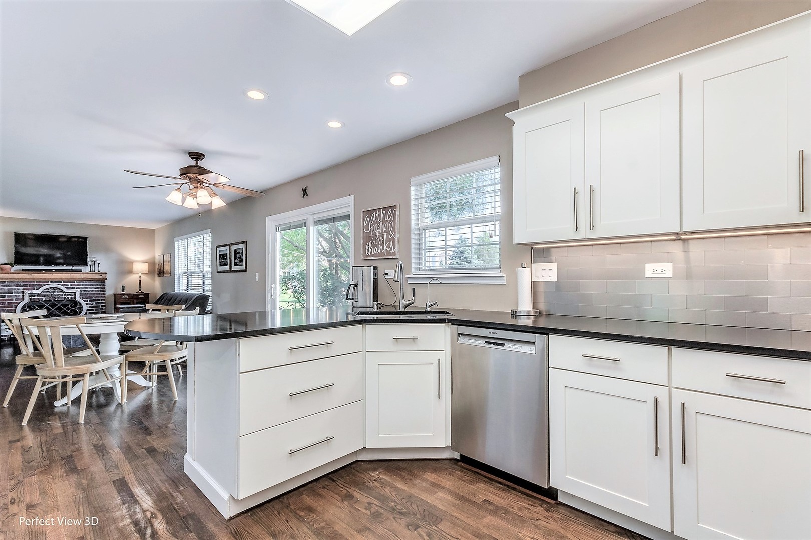 705 Churchill Lane Oswego, IL 60543 - Photo 6 of 34 a kitchen with white cabinets and sink
