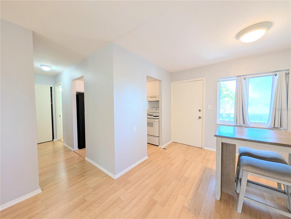 1540 Pleasant Road, Unit G35 Bradenton, FL 34207 - Photo 11 of 23 a view of an empty room with window and wooden floor