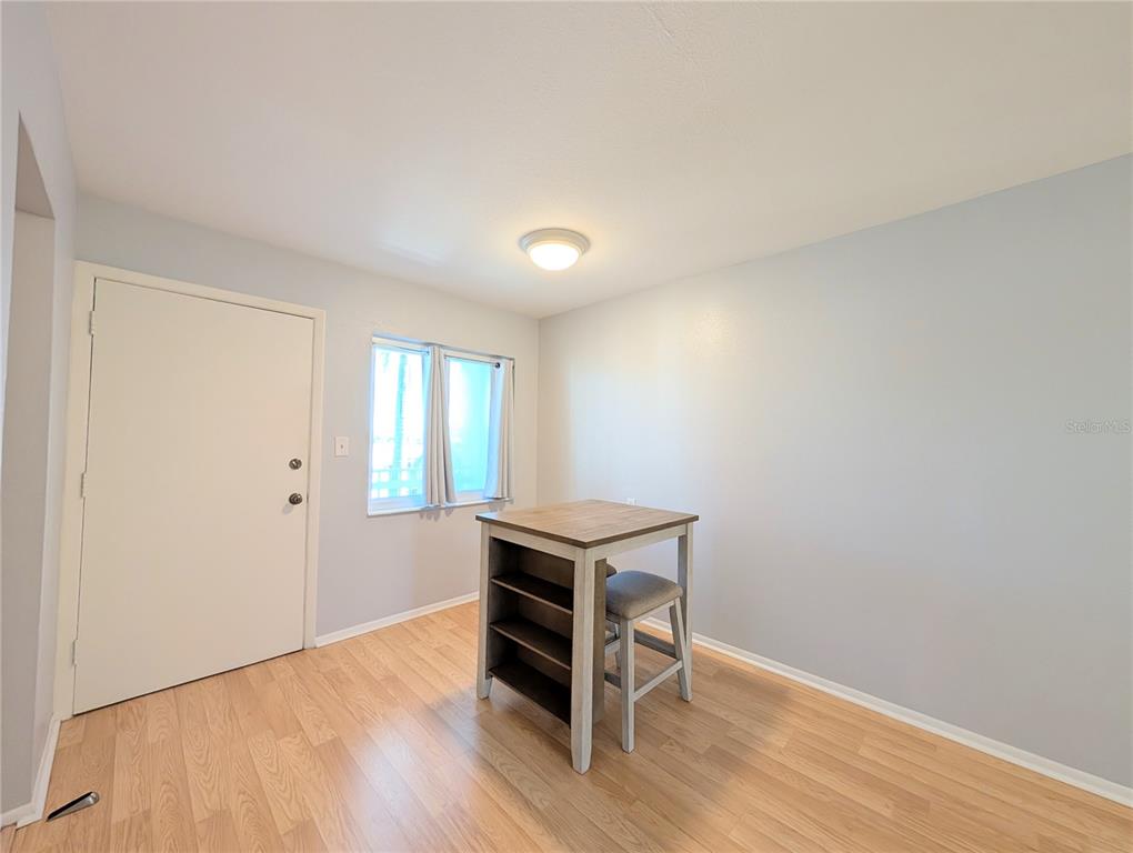 1540 Pleasant Road, Unit G35 Bradenton, FL 34207 - Photo 8 of 23 a room with wooden floor and furniture