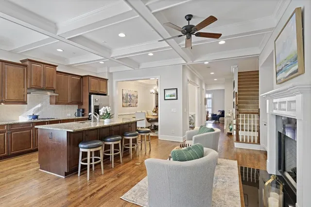 a large kitchen with cabinets table and chairs