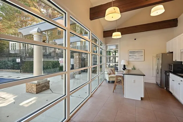 a view of a living room and a large window