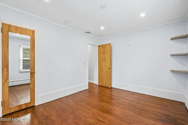 a view of empty room with wooden ceiling